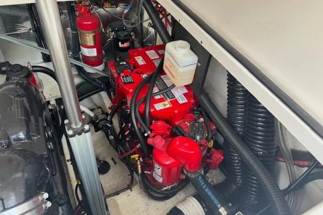 Slide: The Image of Engine compartment of 2023 Regal 28 Express boat with visible components and wiring. - 32
