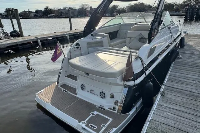 Slide: The Image of 2023 Regal 28 Express boat docked, featuring sleek design and spacious seating. - 7