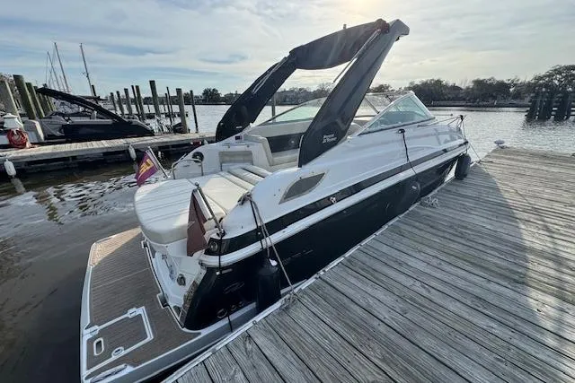 Slide: The Image of 2023 Regal 28 Express boat docked at a marina, showcasing sleek design and modern features. - 9