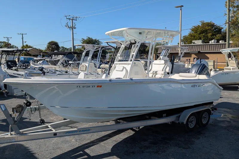 The Image of 2023 Key West 239 FS boat on trailer in a marina setting. - 0