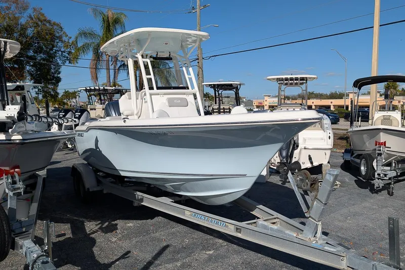 Slide: The Image of 2023 Key West 239 FS boat on trailer in outdoor showroom. - 1