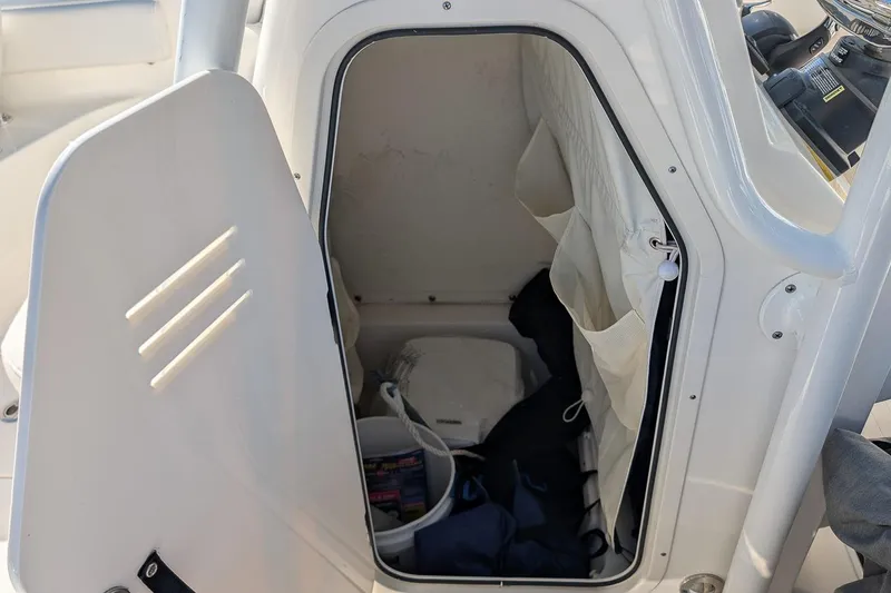 Slide: The Image of Storage compartment inside 2023 Key West 239 FS boat, featuring organized interior space. - 16
