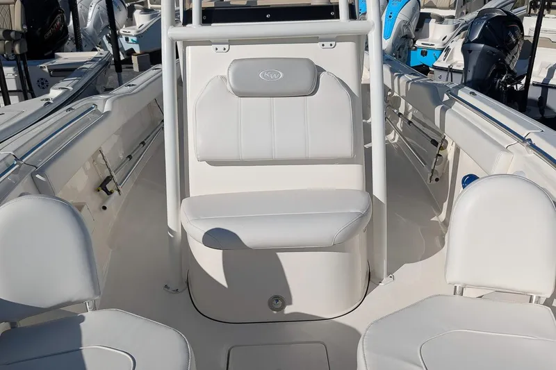 Slide: The Image of 2023 Key West 239 FS boat interior with white seating and modern design. - 18