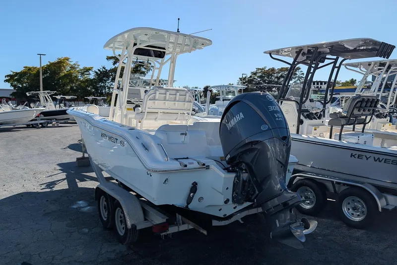 Slide: The Image of 2023 Key West 239 FS boat with Yamaha 300 V6 engine on trailer. - 2