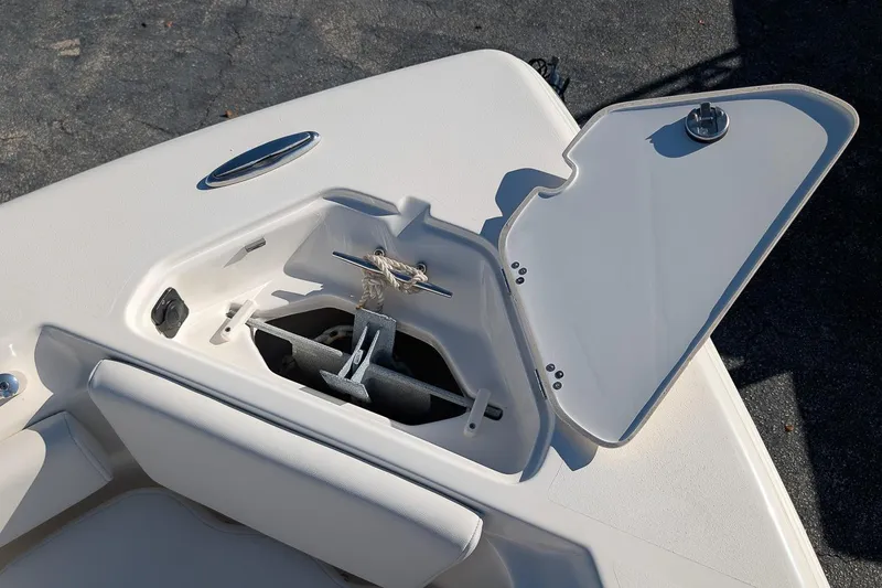 Slide: The Image of 2023 Key West 239 FS boat anchor compartment with open hatch, showcasing storage design. - 20