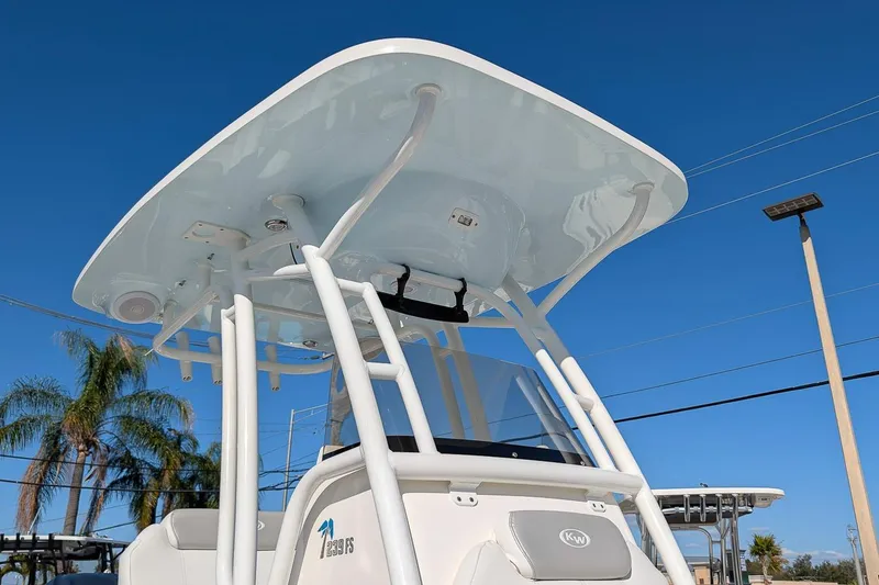 Slide: The Image of 2023 Key West 239 FS boat with T-top against clear blue sky. - 22