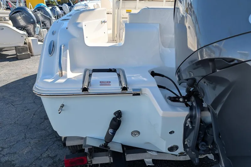 Slide: The Image of 2023 Key West 239 FS boat stern with motor and swim ladder. - 4
