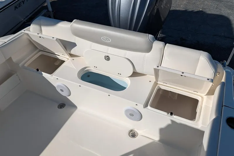 Slide: The Image of 2023 Key West 239 FS boat interior with storage compartments and seating. - 9