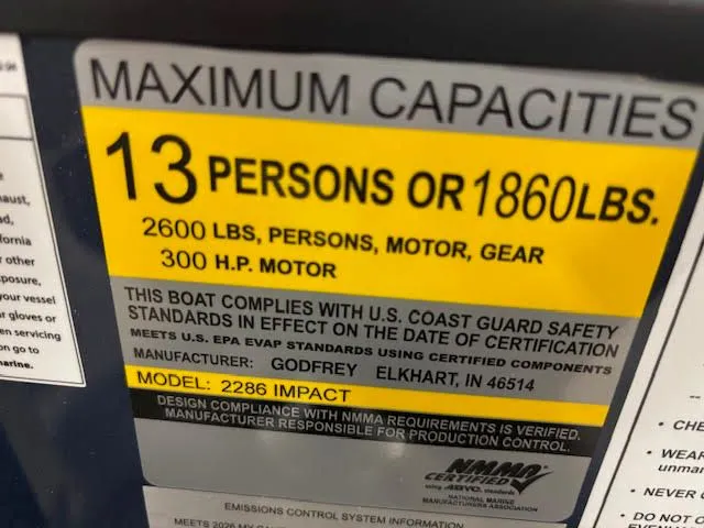 Slide: The Image of Boat capacity label for 13 persons or 1860 lbs, model EX2286SBX, 2026. - 10