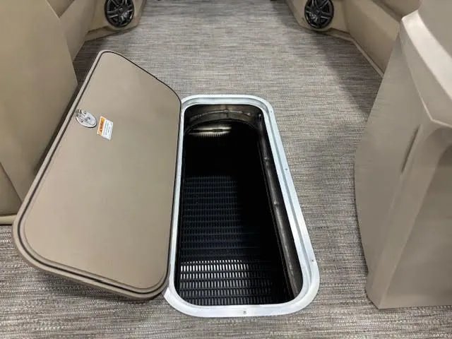 Slide: The Image of Open storage compartment in 2026 Godfrey EX2286SBX boat. - 12