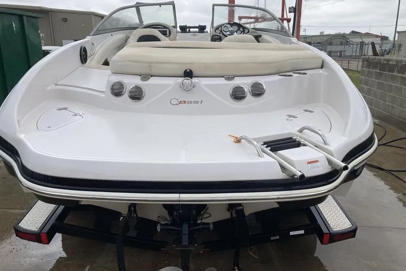 Slide: The Image of 2012 Tahoe Q8 SSi boat, rear view with swim platform and ladder. - 3