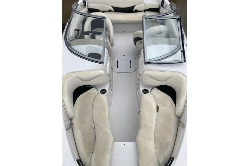 Slide: The Image of 2012 Tahoe Q8 SSi boat interior with white seating and dual windshields. - 8
