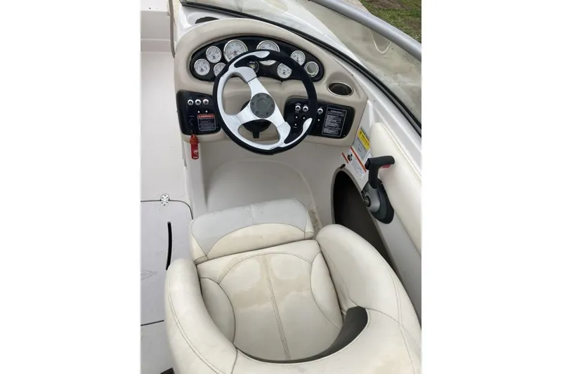 Slide: The Image of 2012 Tahoe Q8 SSi boat cockpit with steering wheel and gauges. - 9