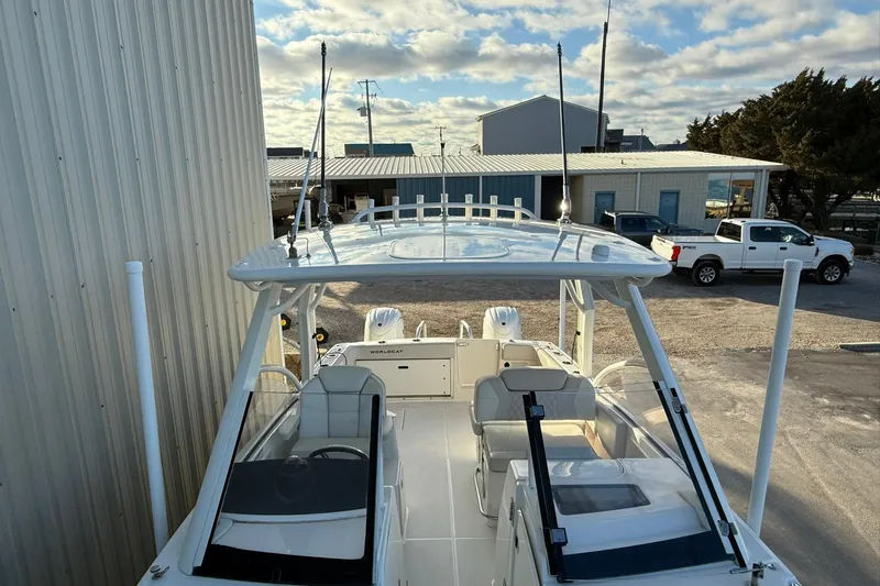 Slide: The Image of 2024 World Cat 280 DC-X boat docked, showcasing spacious deck and modern design. - 22