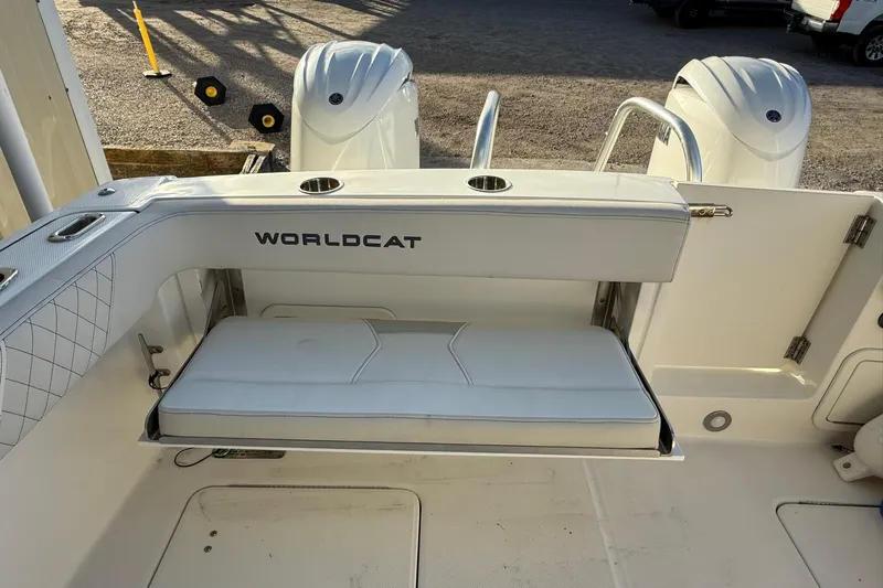 Slide: The Image of 2024 World Cat 280 DC-X boat interior with seating and dual outboard motors. - 24