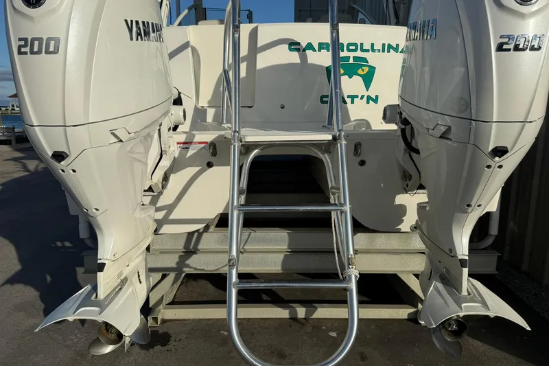 Slide: The Image of 2024 World Cat 280 DC-X with twin Yamaha 200 engines and boarding ladder. - 7