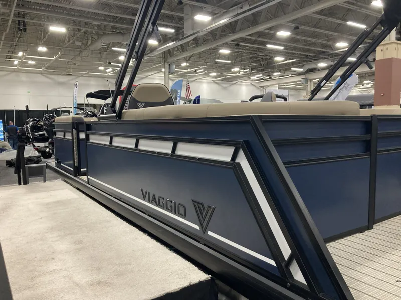Slide: The Image of Viaggio V20U 2026 pontoon boat displayed at a trade show. - 4
