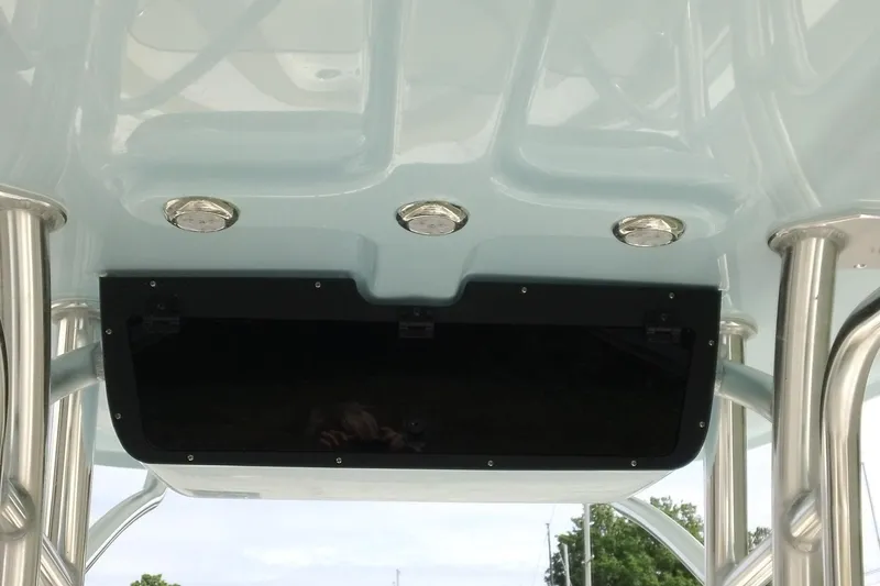 Slide: The Image of 2026 Pioneer 222 Islander boat T-top with integrated lights and sturdy metal supports. - 15