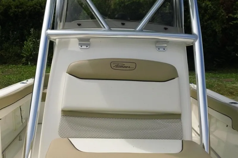Slide: The Image of 2026 Pioneer 222 Islander boat seat with beige and white upholstery, featuring a sleek design. - 19