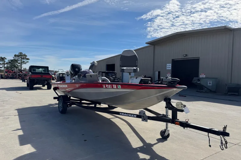 Slide: The Image of 2013 Tracker Pro Team 175 TXW boat on trailer outside a warehouse. - 5