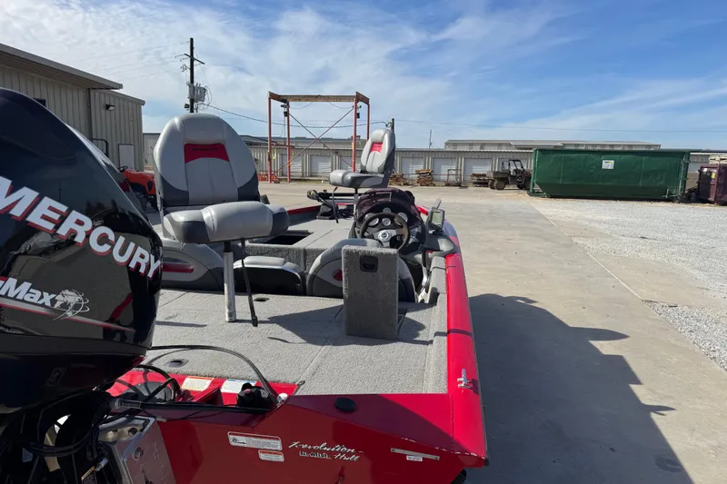 Slide: The Image of 2013 Tracker Pro Team 175 TXW boat with Mercury engine, parked outdoors on concrete. - 6