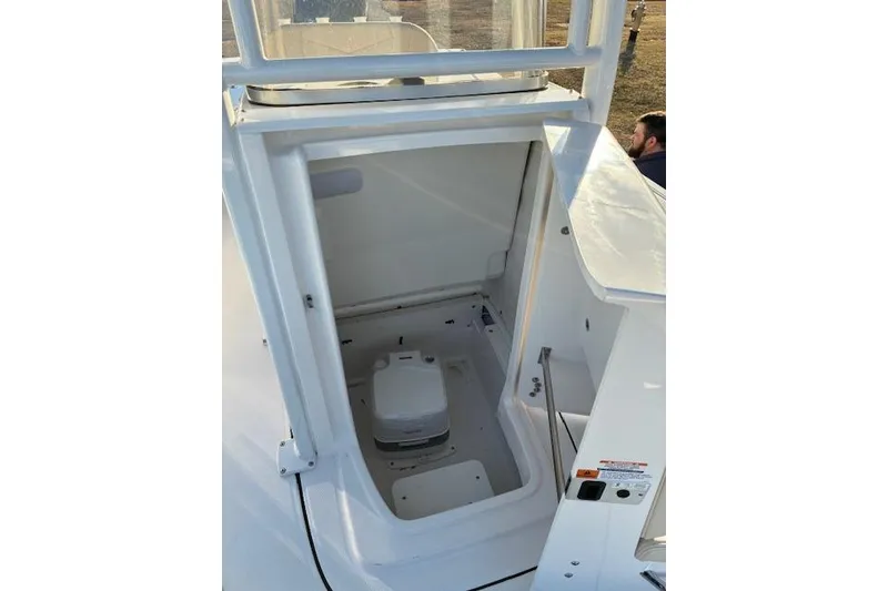 Slide: The Image of Interior of 2026 Robalo 226 Cayman featuring a toilet. - 10