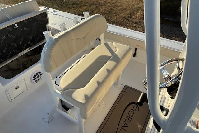 Slide: The Image of Interior of 2026 Robalo 226 Cayman with beige seat and steering console. - 17