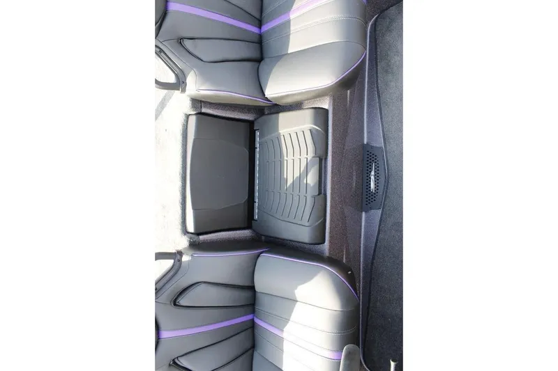 Slide: The Image of 2026 Skeeter ZXE20 interior with sleek black seats and purple accents. - 12