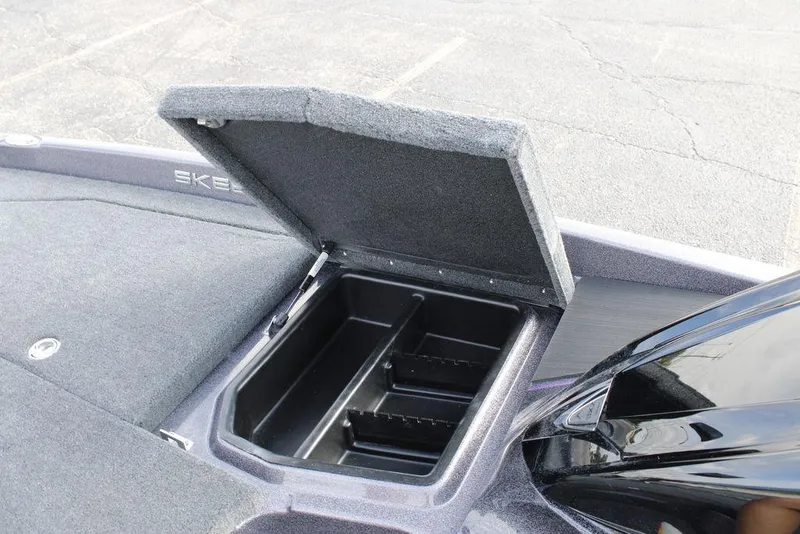 Slide: The Image of Open storage compartment on 2026 Skeeter ZXE20 boat, showcasing interior space. - 9
