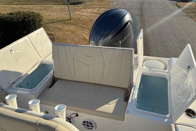 Slide: The Image of 2026 Robalo 226 Cayman with Yamaha engine, rear seat, and storage compartments. - 14