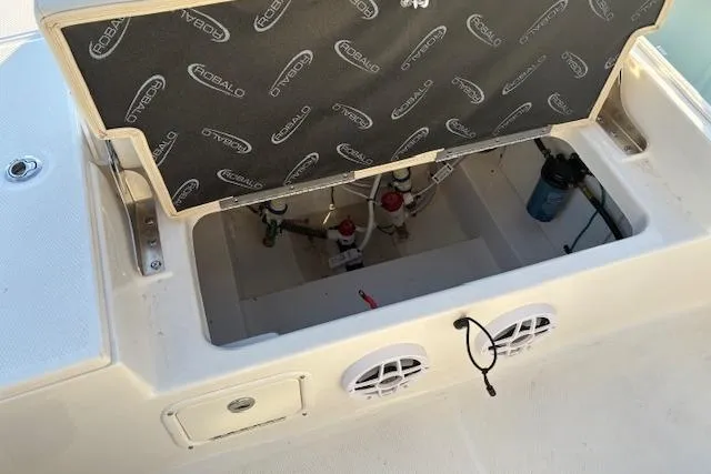 Slide: The Image of Robalo 226 Cayman 2026, open storage compartment with technical components. - 16