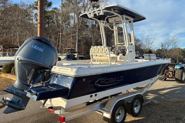 Slide: The Image of 2026 Robalo 226 Cayman boat with Yamaha engine on trailer. - 4