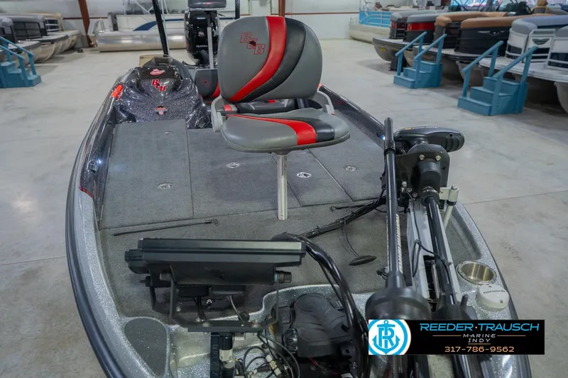 Slide: The Image of 2016 Bass Cat Cougar boat interior with fishing seat and equipment in showroom. - 12