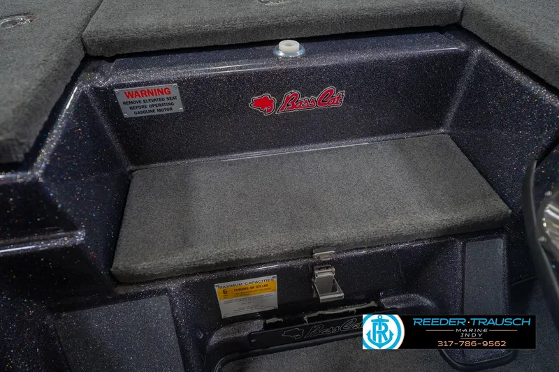 Slide: The Image of 2016 Bass Cat Cougar boat interior with warning label and logo. - 23