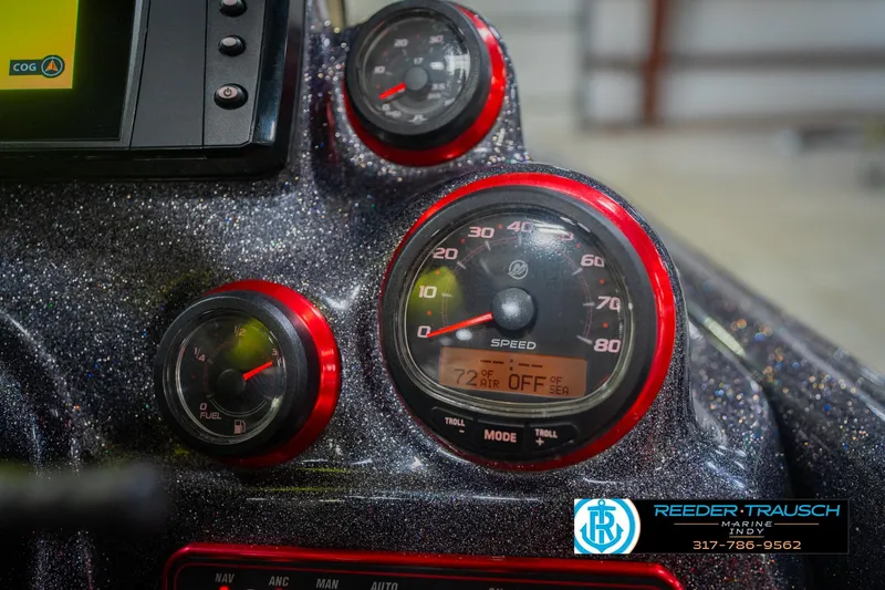 Slide: The Image of Dashboard of a 2016 Bass Cat Cougar boat with speedometer. - 34