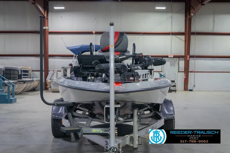 Slide: The Image of 2016 Bass Cat Cougar boat in showroom, front view on trailer. - 4