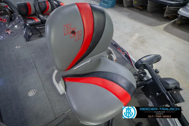 Slide: The Image of Bass Cat Cougar 2016 boat seat with gray and red design. - 42