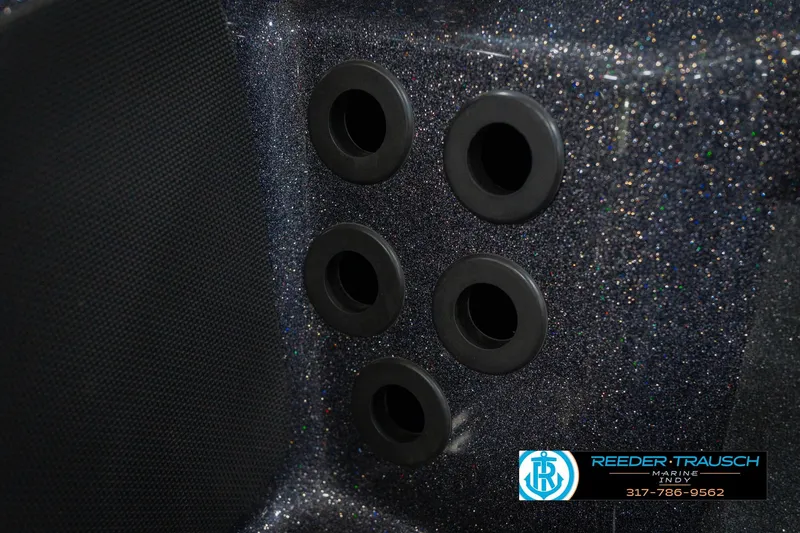 Slide: The Image of 2016 Bass Cat Cougar boat detail with six black circular ports, glitter finish. - 46