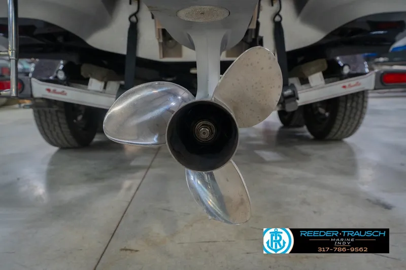 Slide: The Image of 2016 Bass Cat Cougar boat propeller and trailer in a showroom. - 51