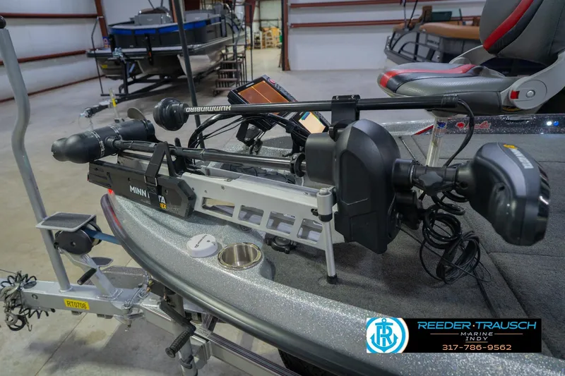 Slide: The Image of 2016 Bass Cat Cougar boat with Minn Kota trolling motor in a showroom. - 52