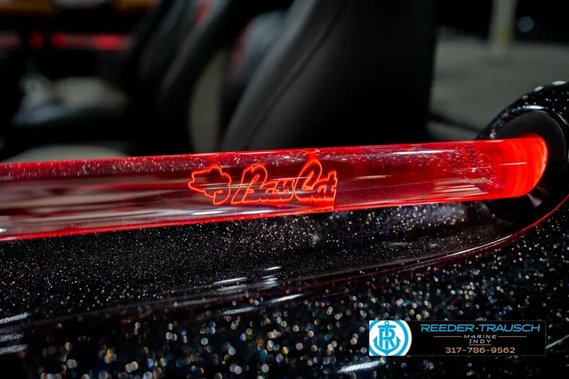 Slide: The Image of 2016 Bass Cat Cougar boat with illuminated red logo detail. - 56