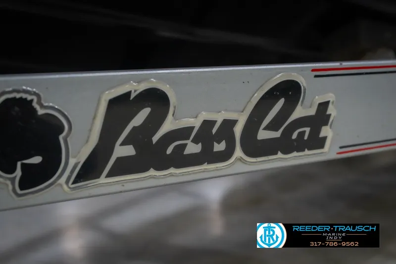 Slide: The Image of 2016 Bass Cat Cougar logo on boat trailer with Reeder-Trausch Marine contact details. - 60