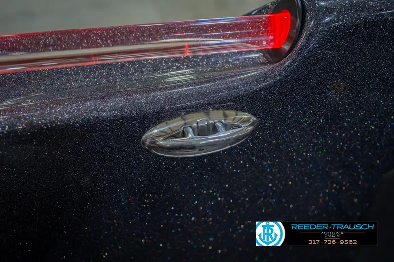 Slide: The Image of 2016 Bass Cat Cougar boat with metallic finish and red light detail. - 63