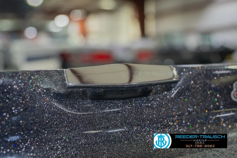 Slide: The Image of 2016 Bass Cat Cougar boat detail with metallic finish and Reeder Trausch Marine logo. - 64