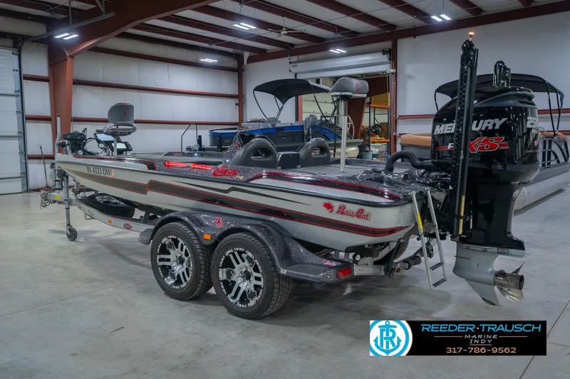 Slide: The Image of 2016 Bass Cat Cougar boat in a showroom with Mercury engine. - 9