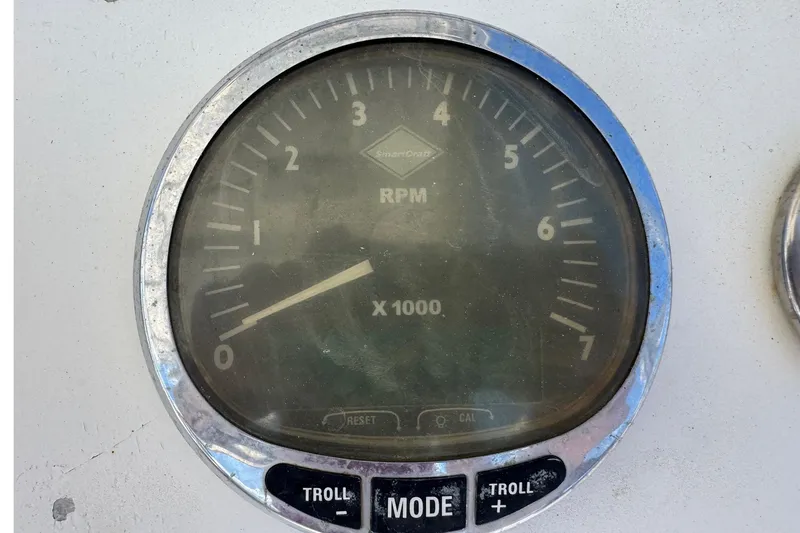 Slide: The Image of Close-up of a tachometer gauge on a 2001 Pro-Line 30 Express boat. - 11