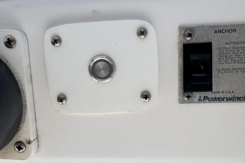 Slide: The Image of Control panel of a 2001 Pro-Line 30 Express boat with anchor switch and instructions. - 12