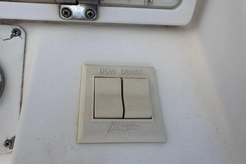 Slide: The Image of Bennett trim tab control on 2001 Pro-Line 30 Express boat. - 13