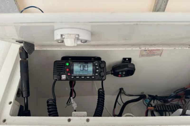 Slide: The Image of 2001 Pro-Line 30 Express boat radio equipment in storage compartment. - 16