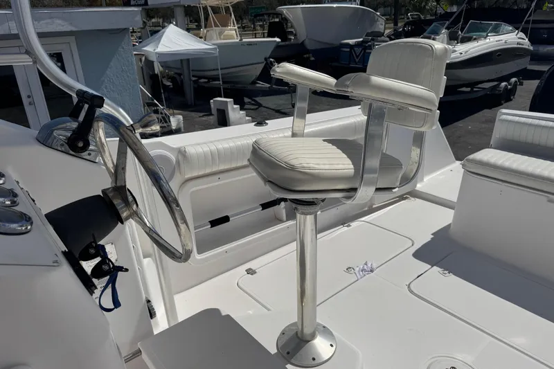 Slide: The Image of 2001 Pro-Line 30 Express boat helm with steering wheel and captain's chair. - 17
